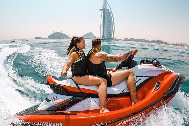 Experience the thrill of jet skiing along Dubai's coastline taking in stunning views of the Burj Khalifa and iconic landmarks like Atlantis and the Palm Jumeirah.